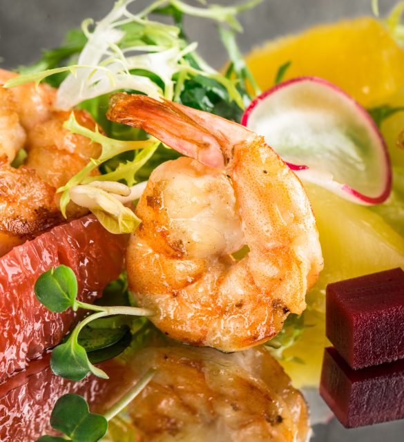 Close up of citrus shrimp salad with mirror reflection