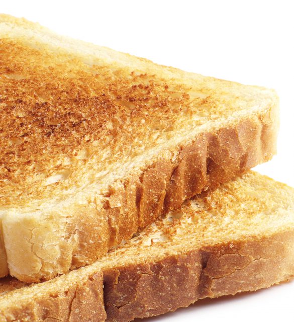 Two roasted toast bread on white background closeup