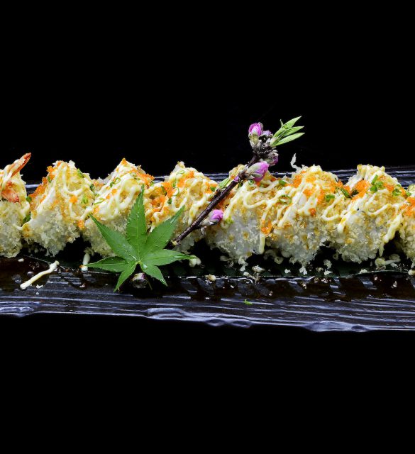 ebi tempura maki. Japanese sushi shrimp tempura roll on black isolated background. Japanese tradition fusion food style.